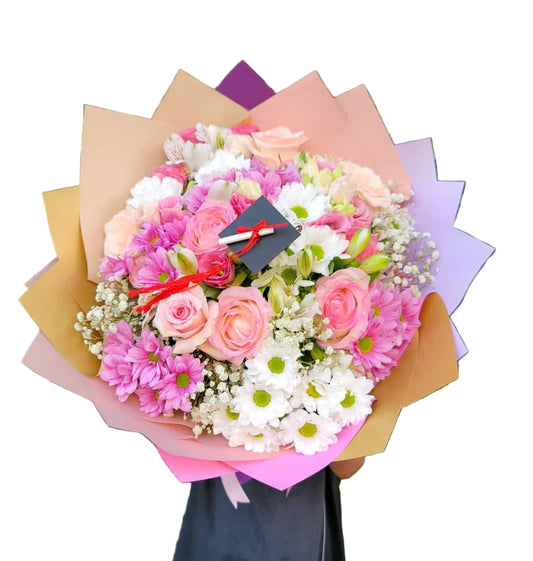 Bouquet of flowers with a graduation cap and tassel on a white background