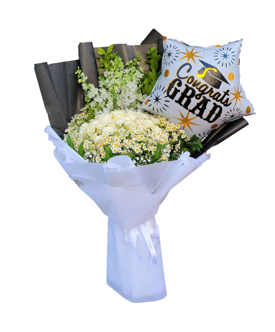 A graduation bouquet featuring white roses and daisies, wrapped in white paper with a 'Congrats Grad!' star-shaped balloon attached.