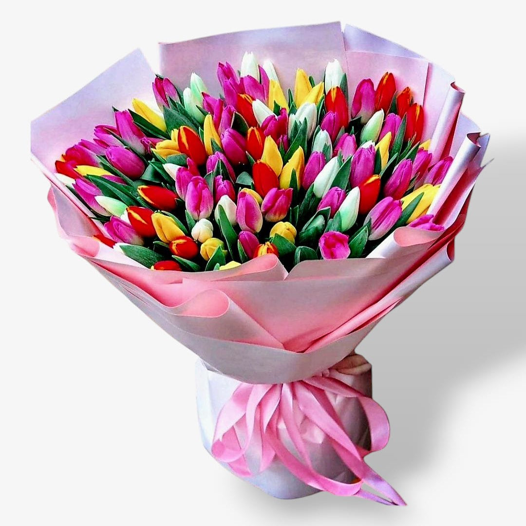 A luxurious bouquet of 100 colorful tulips wrapped in pink and white paper with a soft ribbon, ideal for gifting on special occasions.