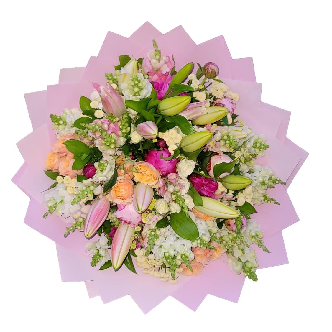 A mixed flower bouquet with a predominance of pink roses and lilies, wrapped in pink paper.