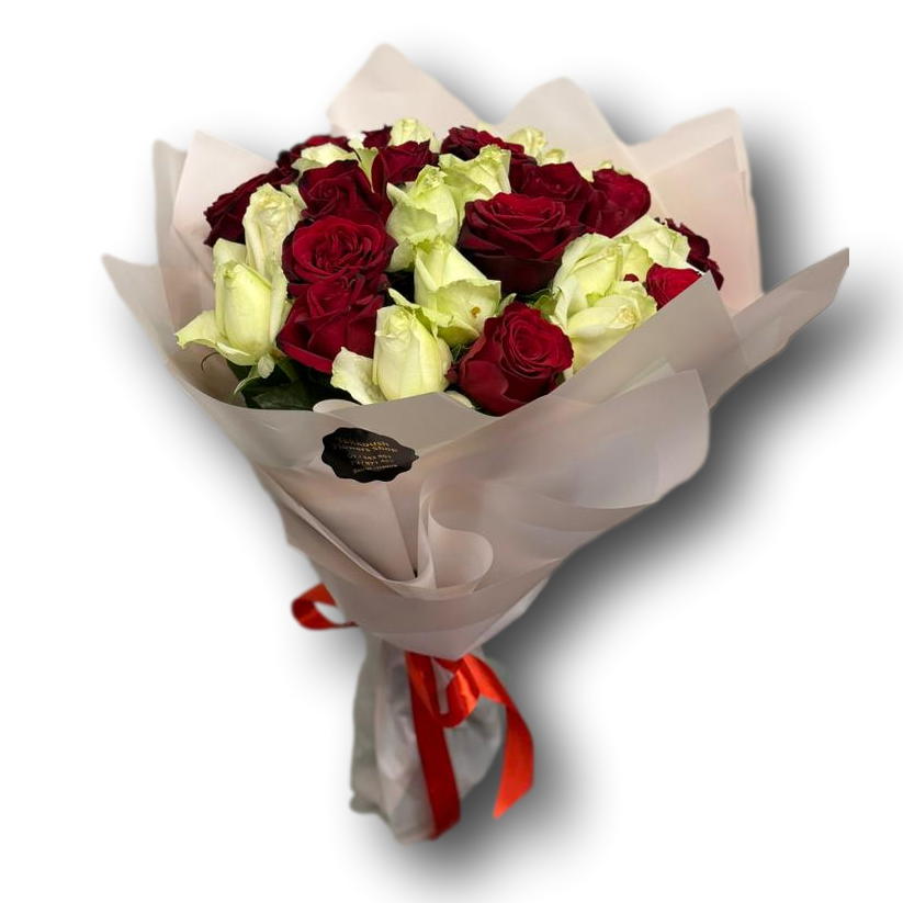 Bouquet of red and white roses wrapped in brown paper with a red ribbon on a white background