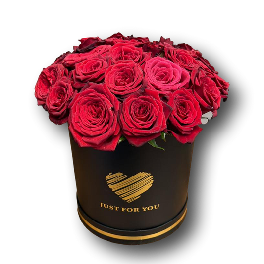 A refined black flower box filled with rich red roses and finished with a gold “Just For You” detail. Elegant, intimate, and deeply romantic—crafted to express love in the most timeless way.