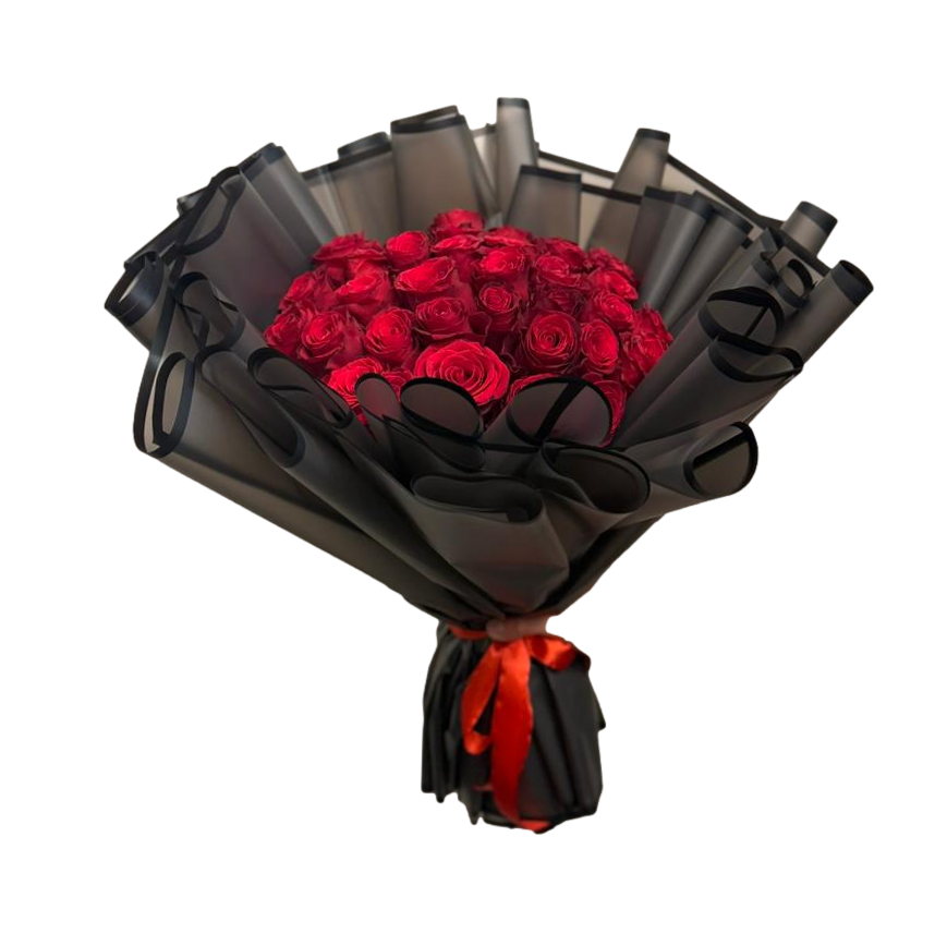 Bouquet of red roses wrapped in black paper with a red ribbon on a white background
