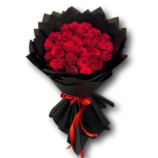 Luxury bouquet of 30 red roses wrapped in elegant black paper with a red ribbon, symbolizing love and passion, ideal for Valentine’s Day