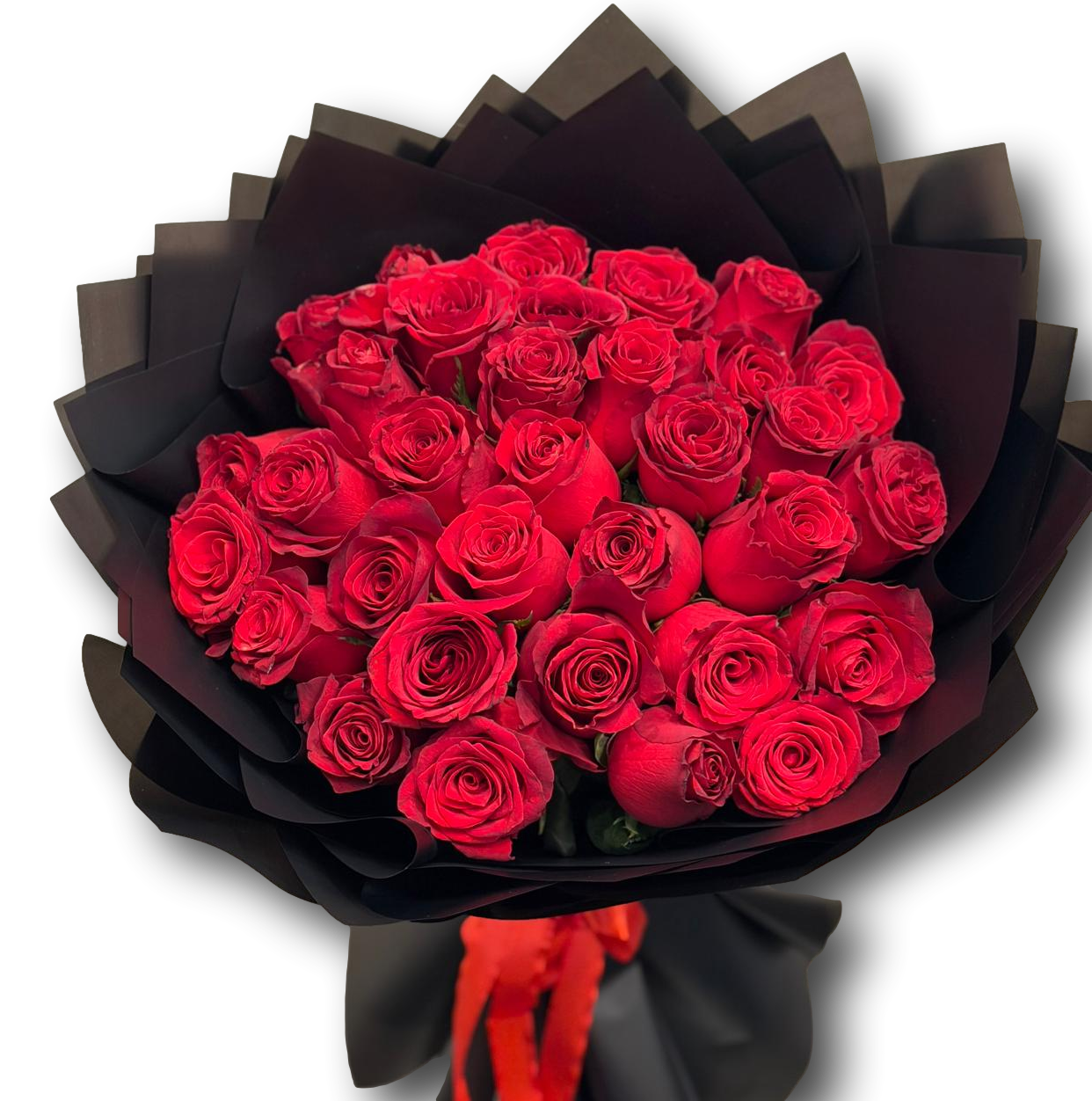 Bouquet of red roses wrapped in black paper on a white background