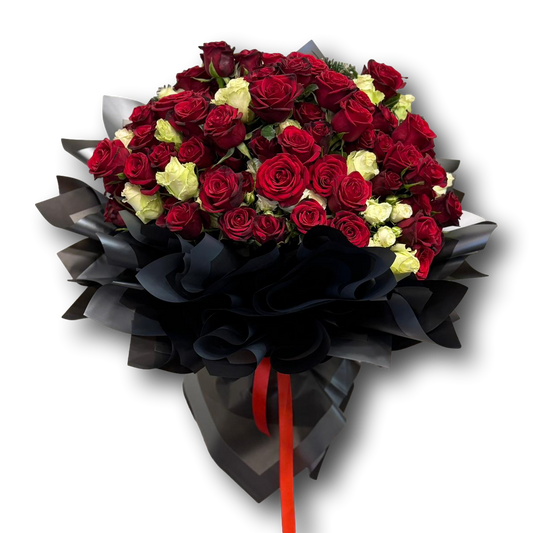 Luxurious bouquet of 65 roses featuring rich red blooms with soft ivory accents, wrapped in dramatic black layers, designed for Valentine’s Day and grand romantic gestures