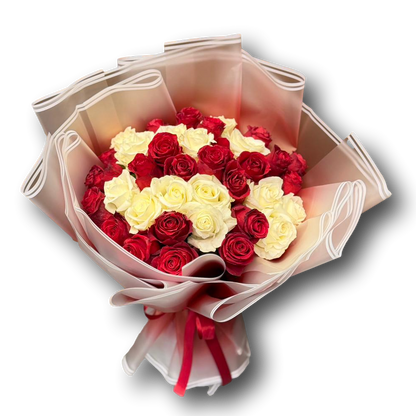 Elegant bouquet of 40 roses featuring red and ivory blooms, wrapped in soft translucent layers with a red ribbon, perfect for Valentine’s Day and romantic gifting