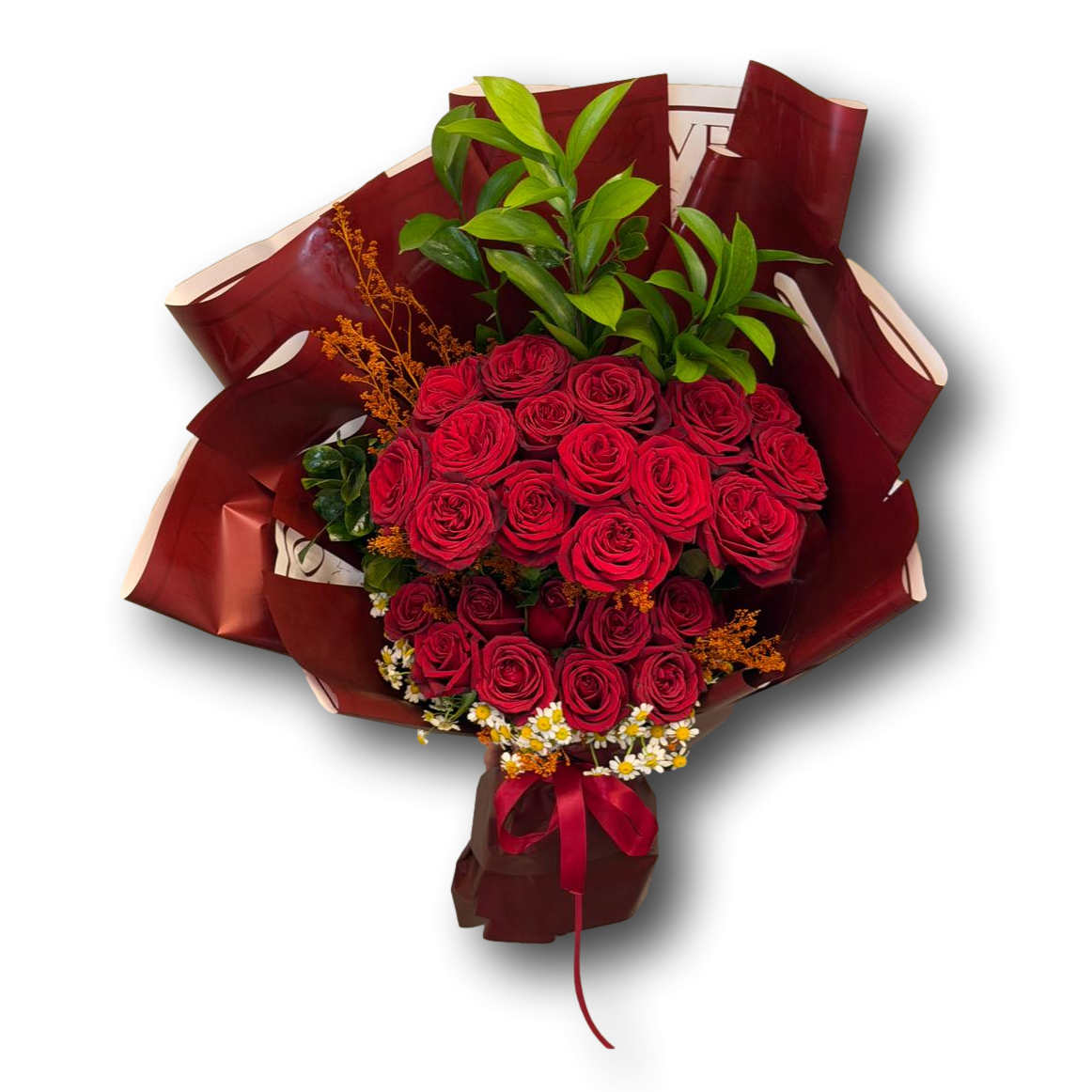 Elegant bouquet of 24 red roses arranged with fresh greenery and seasonal fillers, wrapped in deep burgundy paper with a red ribbon
