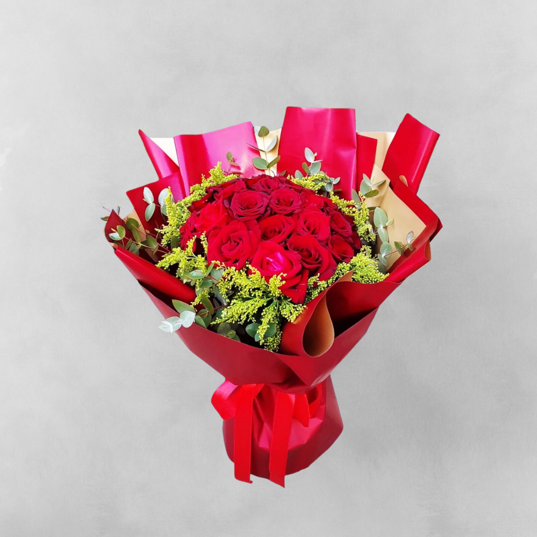 Celebrate the warmth of your love with Sunny Romance - Two Dozen Red Roses & Yellow Solidago. This magnificent bouquet features two dozen of the most stunning red roses, paired with cheerful yellow solidago to create a visual feast. The rich red color of the roses represents love and passion, while the bright yellow of the solidago symbolizes happiness and optimism. This bouquet is the perfect way to express your feelings, whether as a romantic gesture or simply as a thoughtful gift.