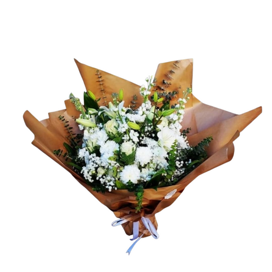 Beautiful white flower bouquet with lilies, roses, chrysanthemums, carnations, and accessories.